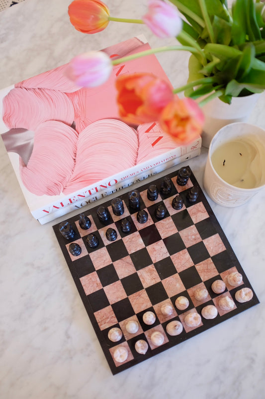 Pink and black marble chess board